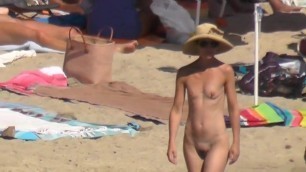 Hot naked small tit hottie walks on nudist beach