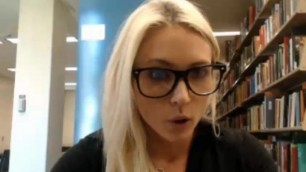 Cute blonde college girl flashing in the library